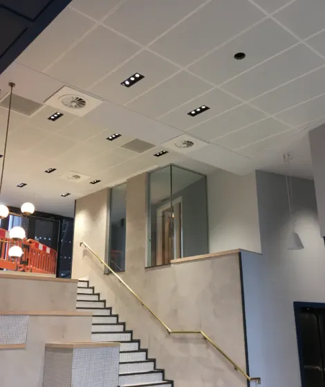 Suspended ceiling grid being installed