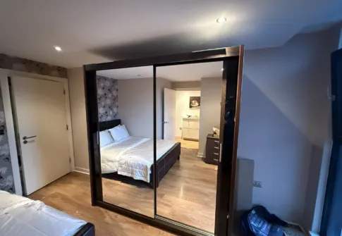 Refurbished apartment bedroom after water-damage reinstatement
